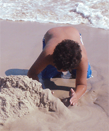 Children pour themselves into their sand play to their satisfaction